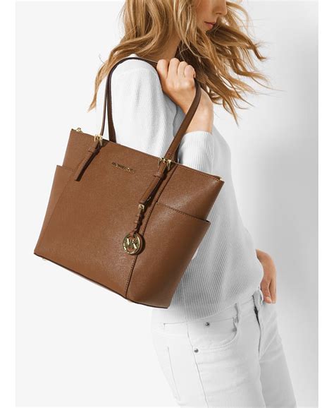 michael kors jet set east west top zip tote peanut|Michael Kors saffiano jet set.